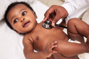 A little baby at a checkup with a doctor at a clinic