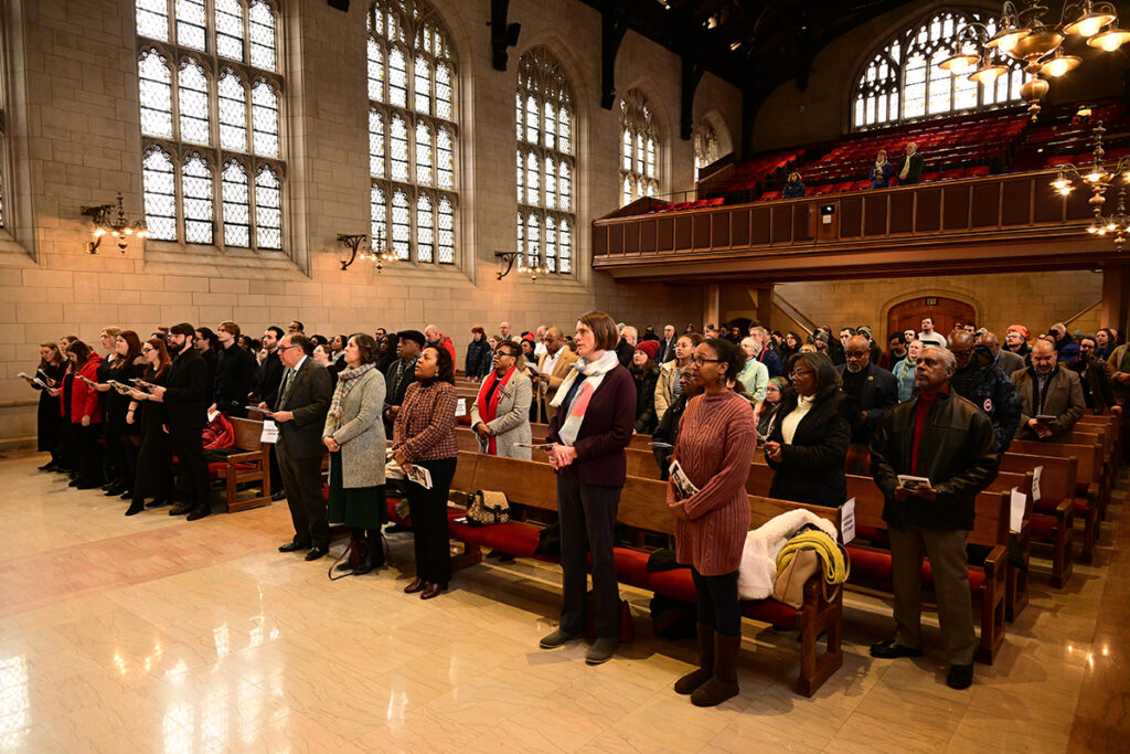 Members of the university community gather