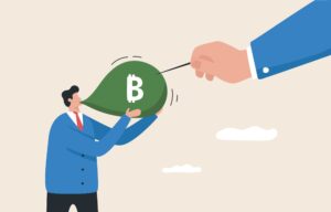 A businessman blows a balloon and a giant hand holds a needle.