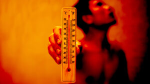 Man holding thermometer