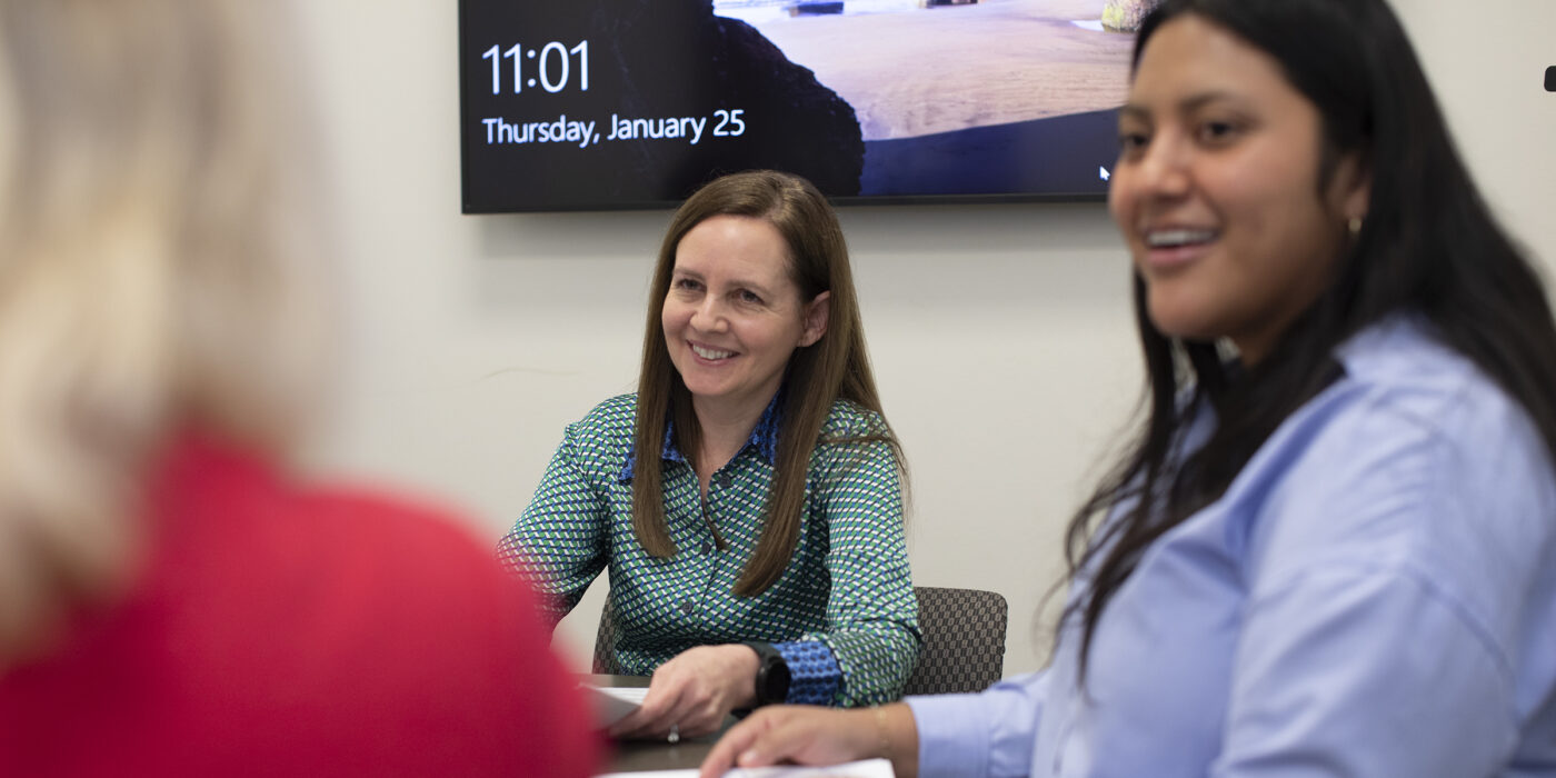 Sarah Narkiewicz, associate dean for clinical education at the School of Law, works with Dinora Orozco (right) and other students in the Low Income Taxpayer Clinic, which she also directs. The law school’s clinical education program includes 12 clinics and seven externships, and in 2023 celebrated 50 years of helping the St. Louis community.