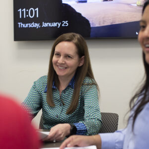 Sarah Narkiewicz, associate dean for clinical education at the School of Law, works with Dinora Orozco (right) and other students in the Low Income Taxpayer Clinic, which she also directs. The law school’s clinical education program includes 12 clinics and seven externships, and in 2023 celebrated 50 years of helping the St. Louis community.