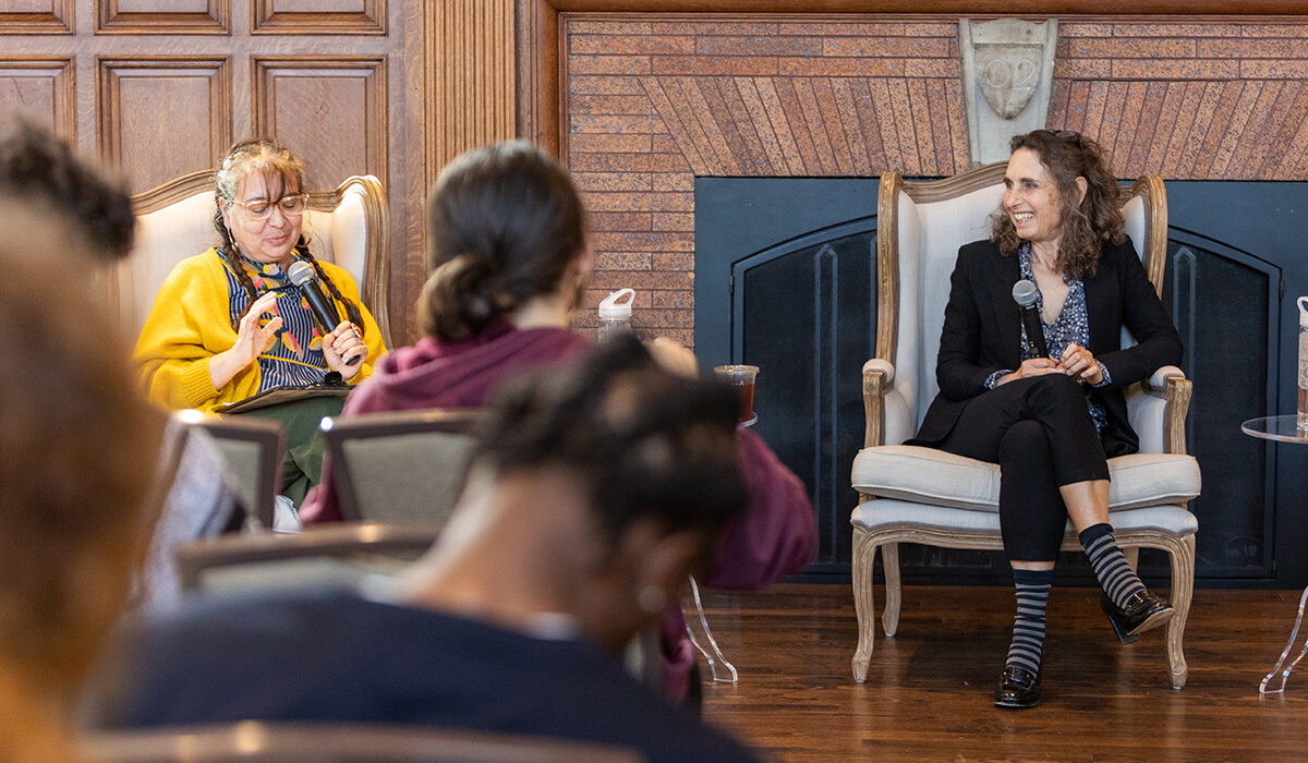 A teacher asks speaker Elizabeth Kolbert a question