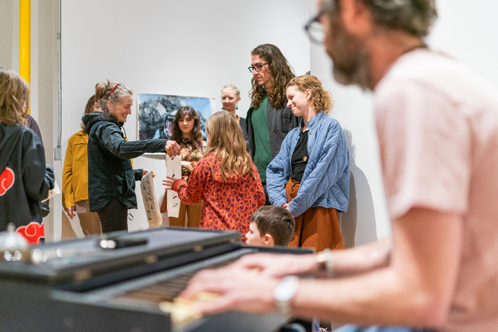 People gather at an art exhibition