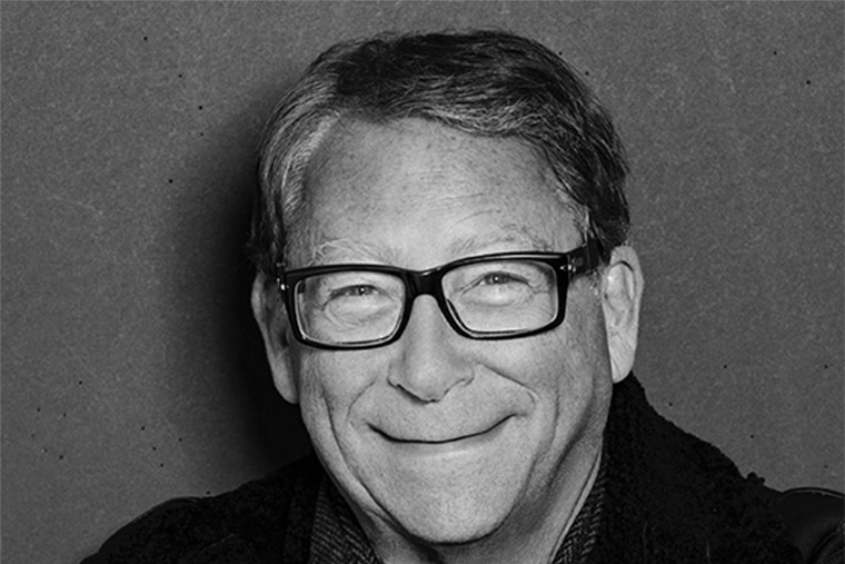 A black and white photo of Stuart Weitzman