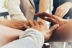 Hands together to demonstrate collaboration and allyship