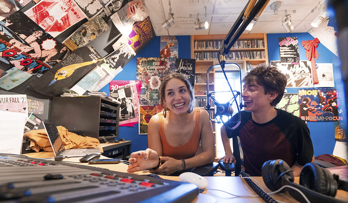 students broadcasting from KWUR studio