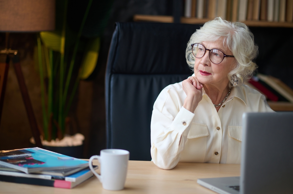 older woman in front of a laptop