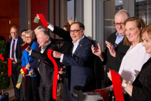 Chancellor Andrew Martin (center) celebrates the dedication of the Jeffrey T. Fort Neuroscience Research Building after cutting the ribbon with WashU leaders and friends, including Jeffrey T. Fort and Fort’s sister, Liz Dorr (both right of Chancellor Martin), Jan. 18. (Photo: Matt Miller)