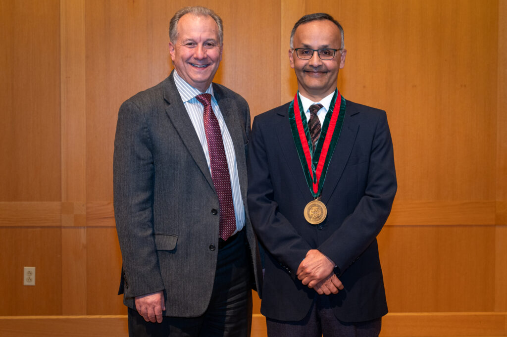 McKelvey Dean Aaron Bobick smiles next to Dr. Sanjoy Baruah.