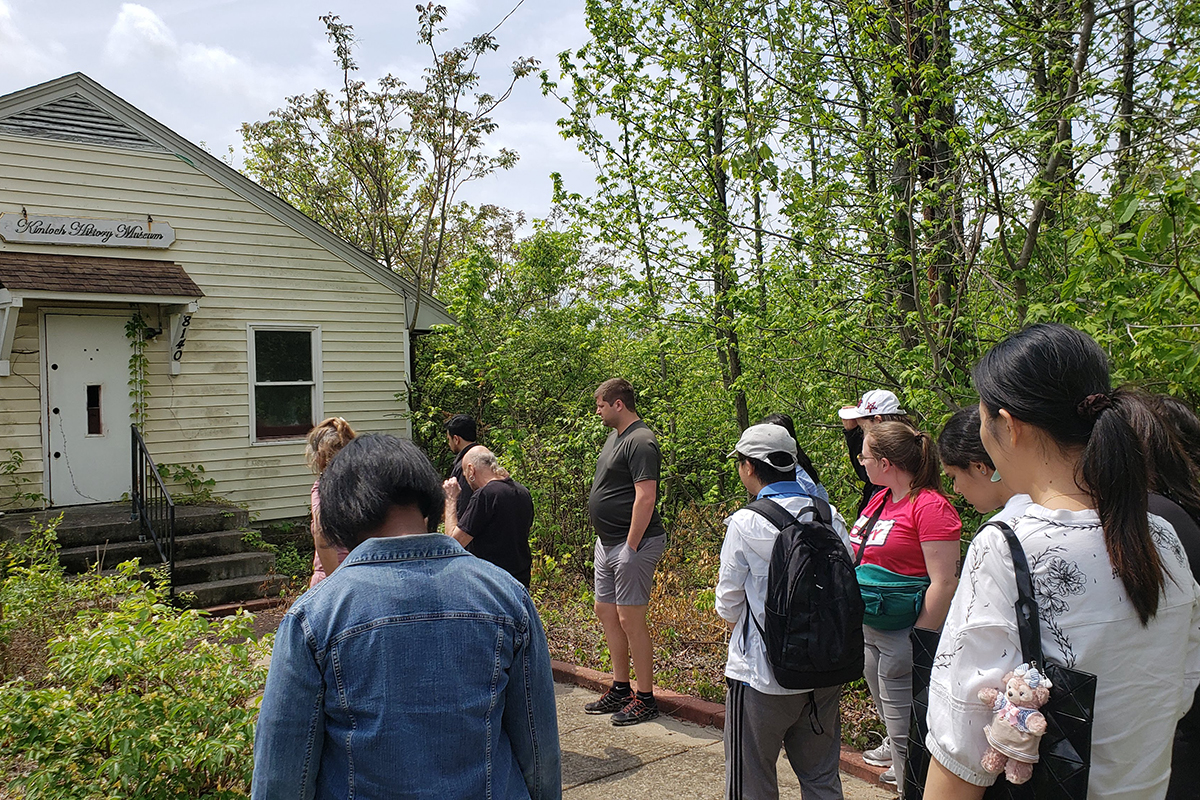 Group stands outside