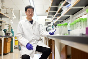 Ping-I (Dennis) Chou in a lab