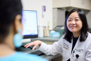 Amy Zhou with a patient