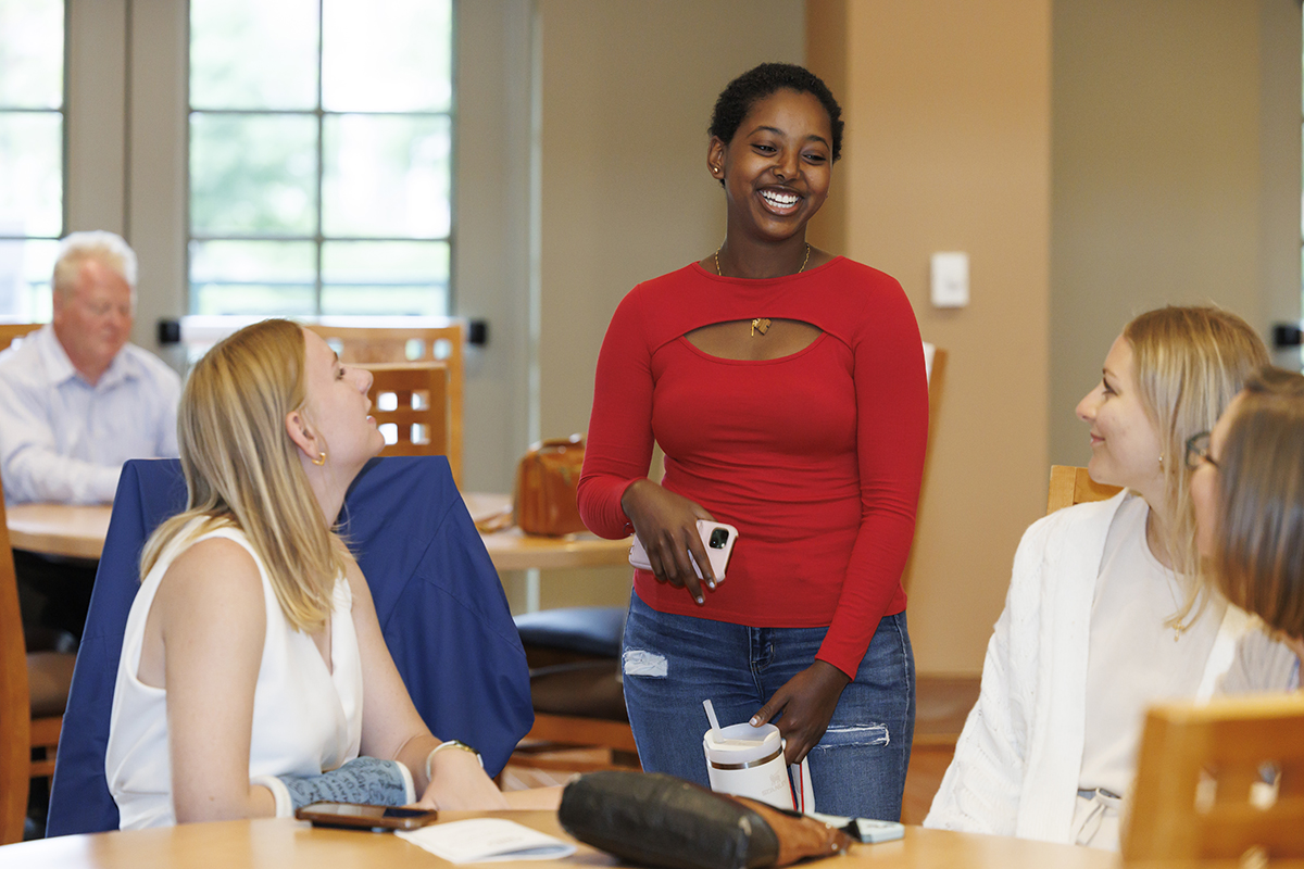 Event participants engage in conversation