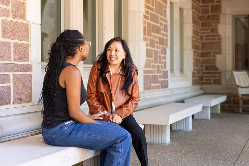 As vice chancellor for student affairs, Anna Gonzalez (right) is charged with supporting all students. Here, she meets with Natasha Chisholm, AB ’24, who is working this summer in the vice chancellor’s office while interviewing for other positions outside St. Louis. (Photo: Courtesy of Jenny Sinamon)