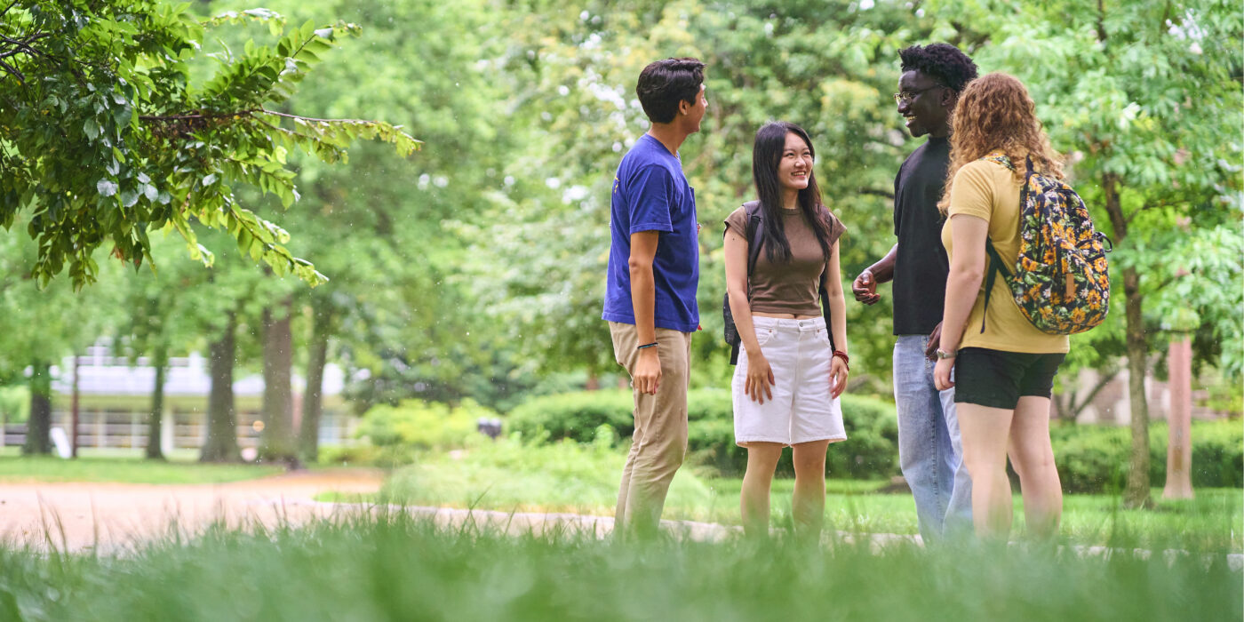 (From left) Emilio Parra-Garcia, Ziyi Zhang, Spencer Annor-Ampofo and Gabriella Jager — students involved with diversity, inclusion, inter-faith and international issues at the university — engage in discussion outside Olin Library. (Photo: Devon Hill/Washington University)