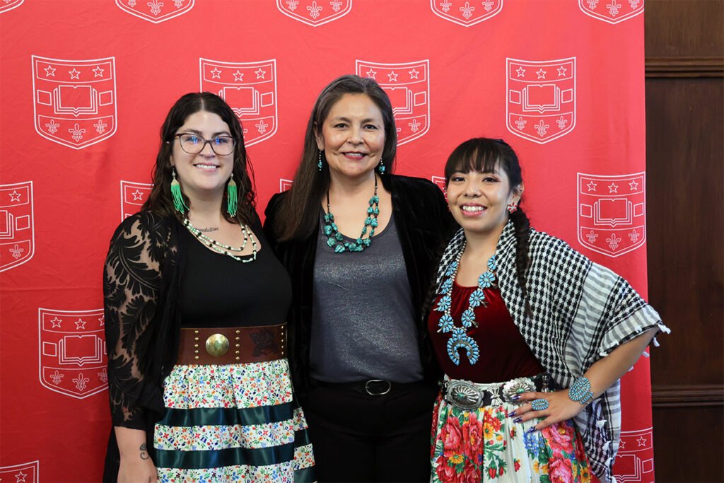 Pamela Begay (center), MSW ’04, director of the Kathryn M. Buder Center for American Indian Studies, gathers with Buder Scholars Ashlyn Newcomb (left), MSW ’24, and Kendra Henry, MSW ’24, at the Buder Blessing before the Brown School recognition ceremony May 11. (Photo: Courtesy of Sharon Riney/Brown School)