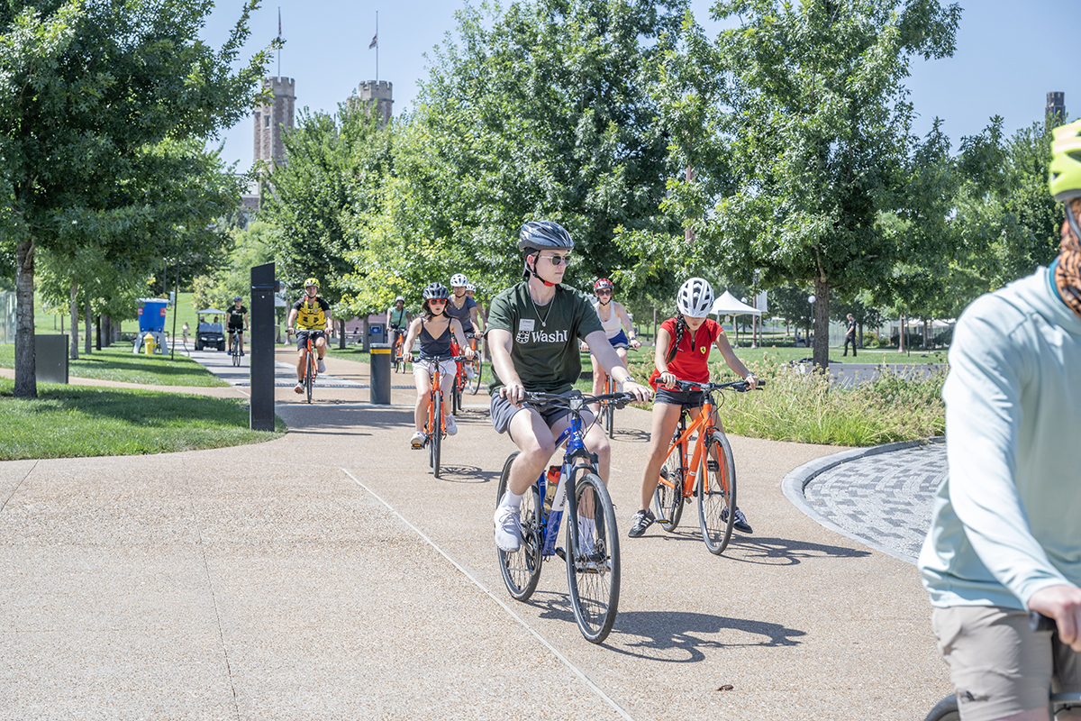 students ride their bikes