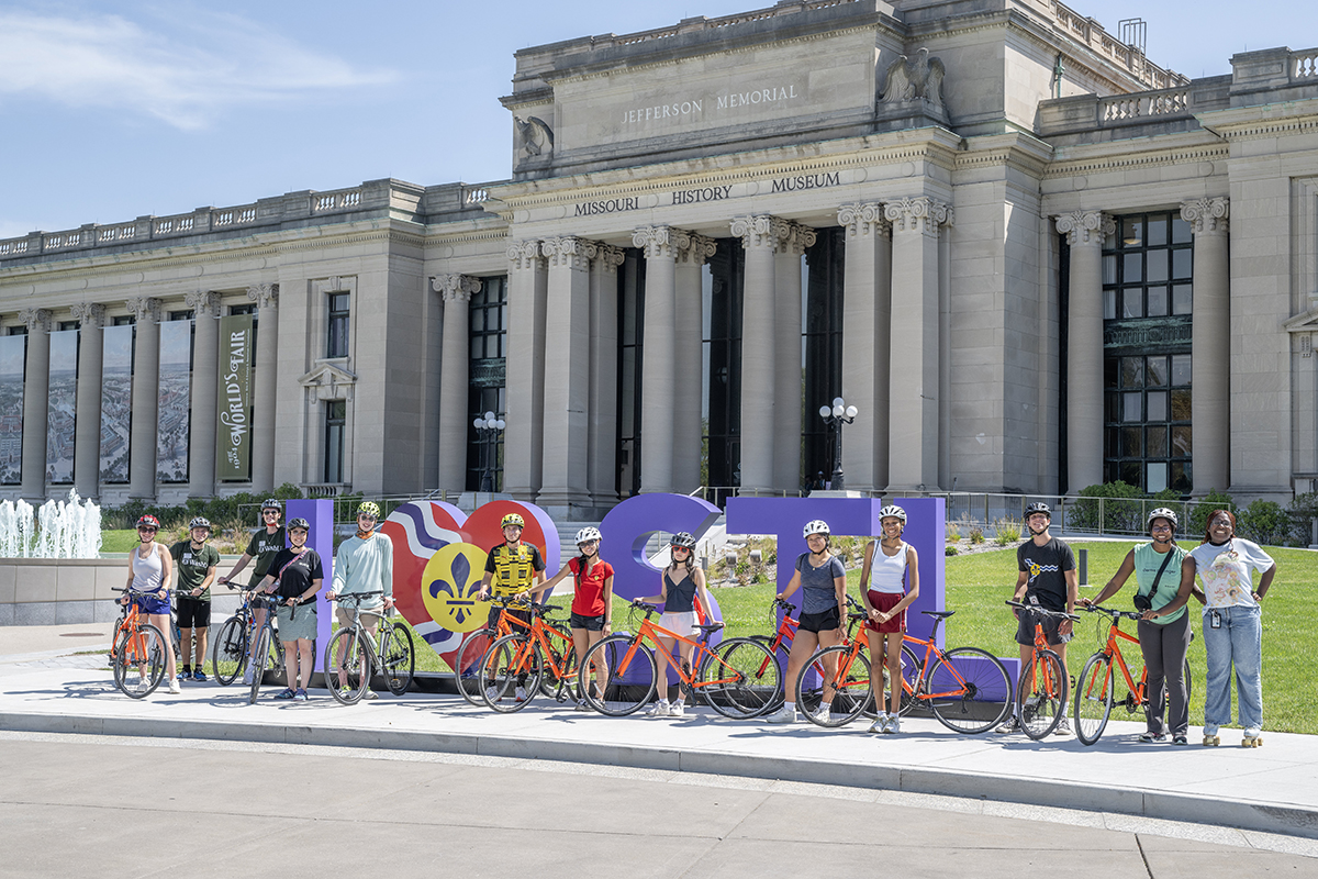 students pose with bikes