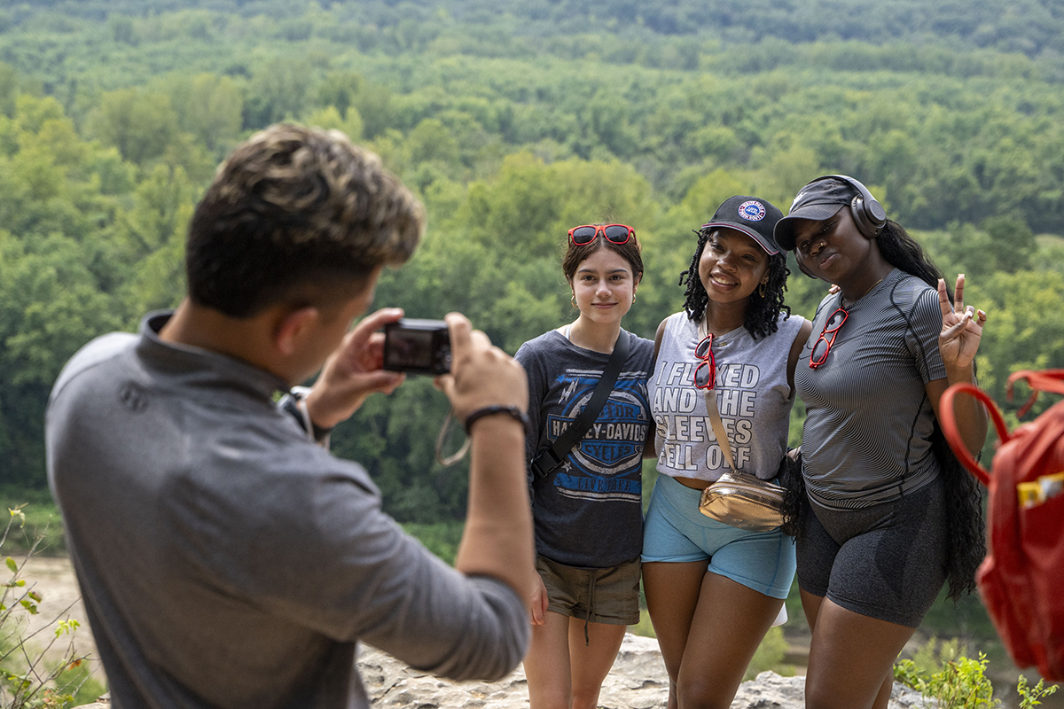 students pose for a photo outside