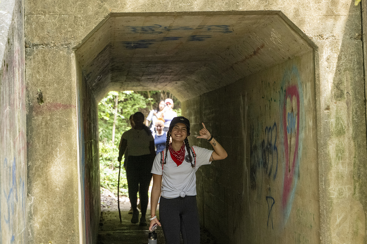 students pose for photo during hike 