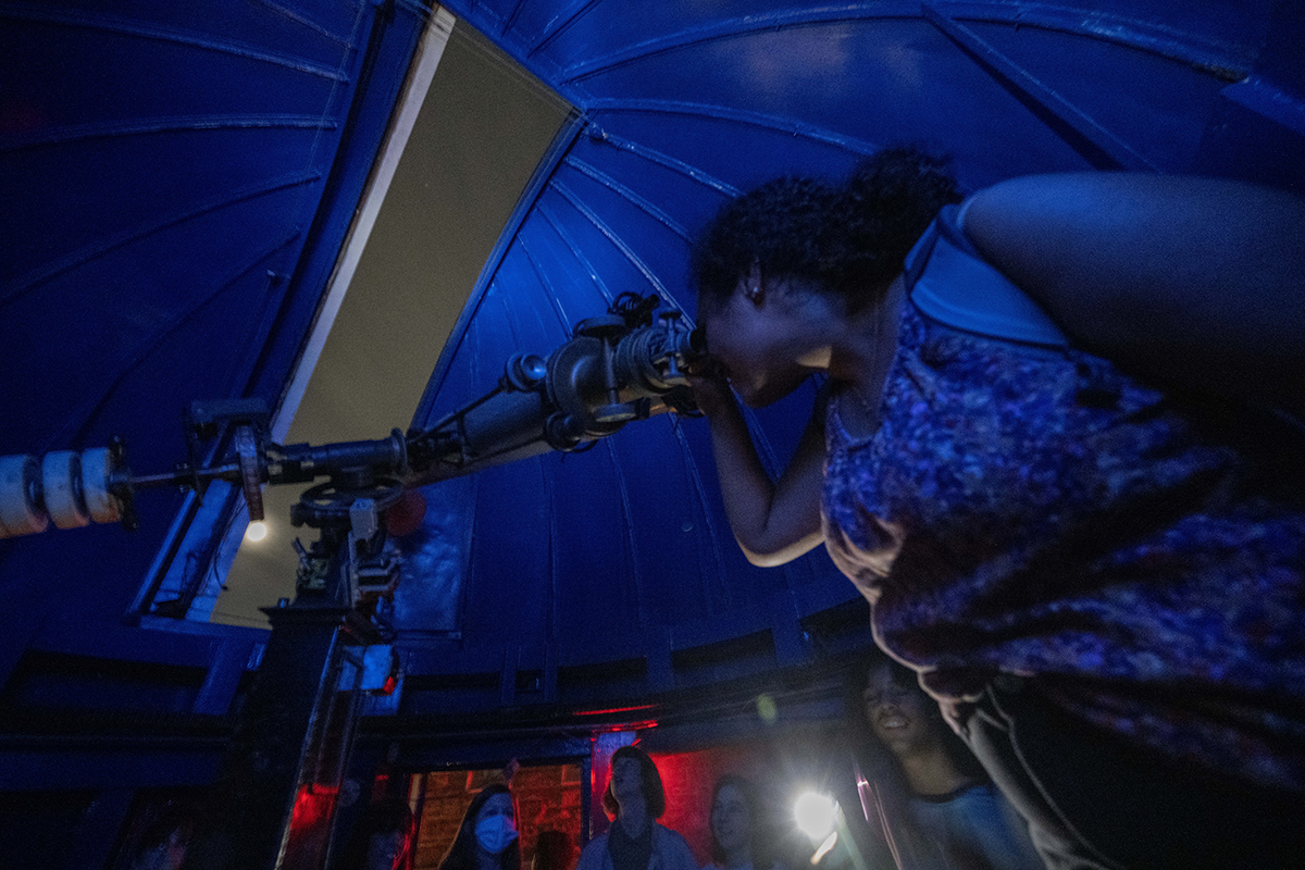 participants look up at the moon