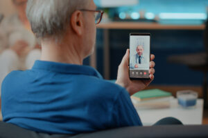 a man talks with a doctor on a smartphone