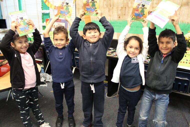 Elementary school students proudly display their new books from Words Alive. (Photo courtesy of Words Alive)