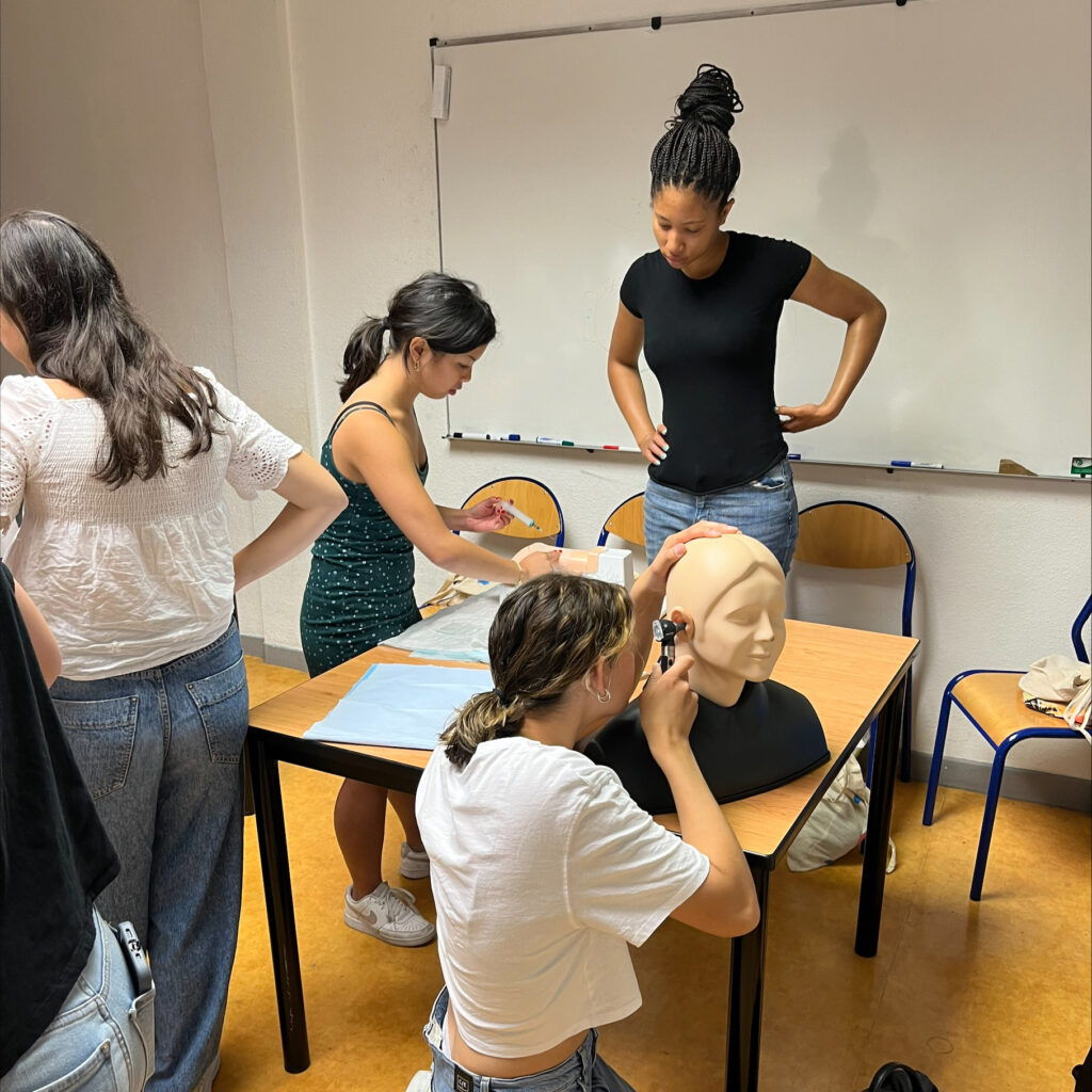 Students practice ear examinations and blood draws in a hands-on session at the Medical Simulation Center, Côte d’Azur University Medical School. (Courtesy photo)