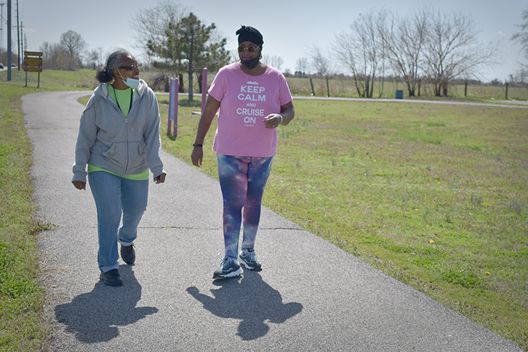 Two women on a walking trail in rural Missouri.