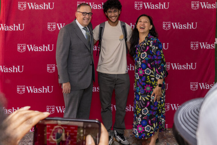 Chancellor Andrew Martin (left) and Anna Gonzalez (right), vice chancellor for student affairs, welcome students in the Underpass during the first day of classes, Aug. 26.