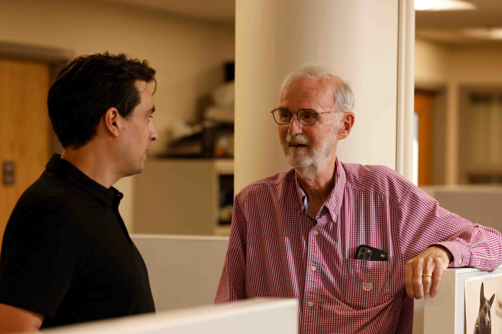 Nico U. F. Dosenbach, MD, PhD (left), confers with Marcus Raichle, MD, the Alan A. and Edith L. Wolff Distinguished Professor of Medicine at WashU Medicine. One of the world’s leading neuroimagers, Raichle discovered the default mode network in 2001, and new research has shown that psychedelic drugs profoundly disrupt this network. (Photo: Matt Miller/WashU Medicine)