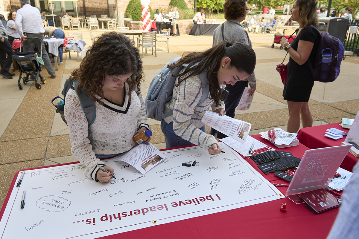 students write on poster