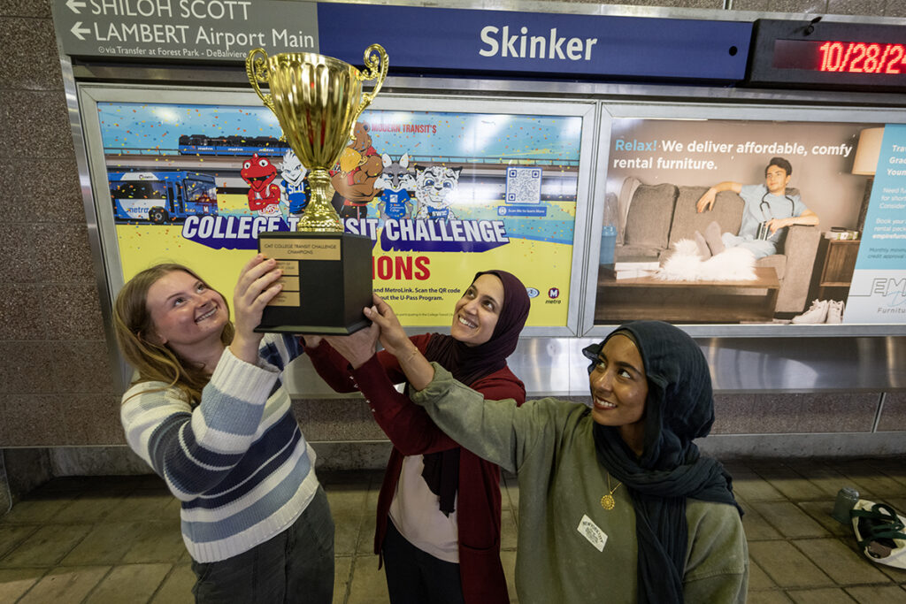 Students hold a trophy