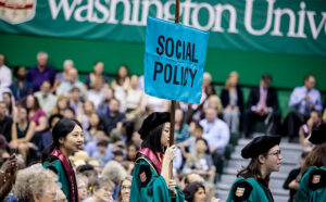 social policy banner at a graduation ceremony