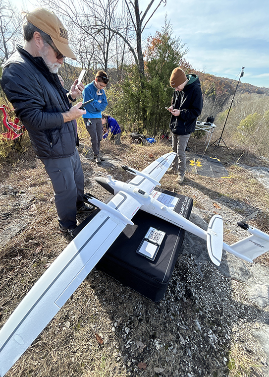 students prepare drone for launch