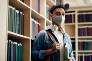 African American college student wearing a face mask