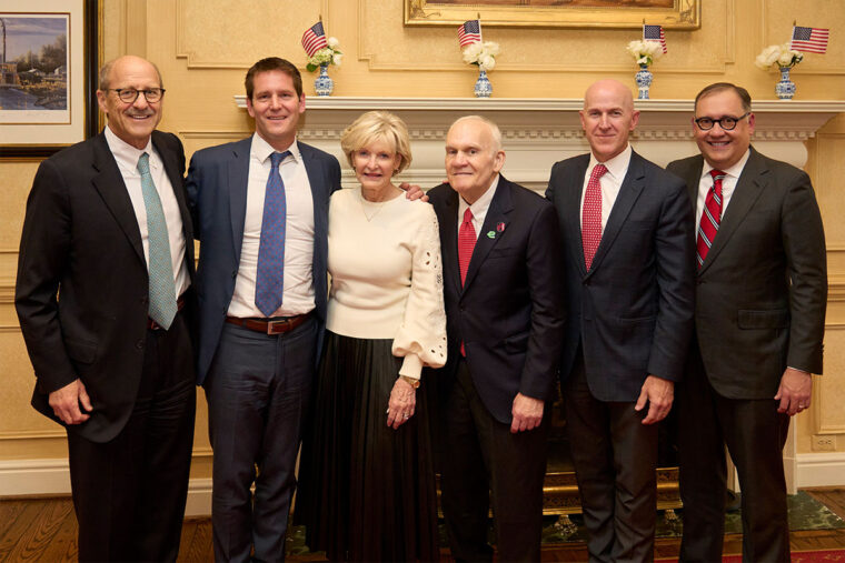 WashU leaders and the Taylors at a celebration