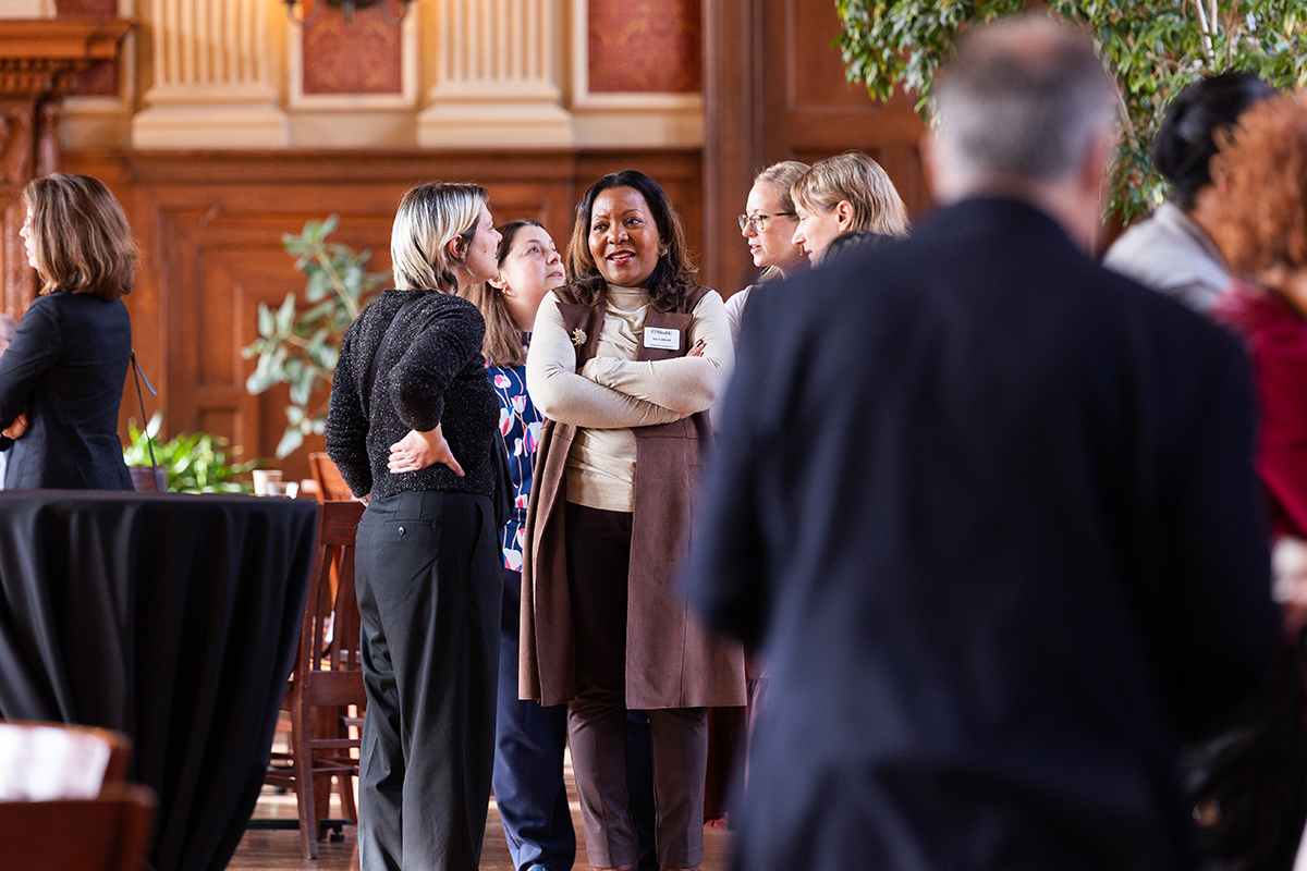 Women faculty members engage in conversation