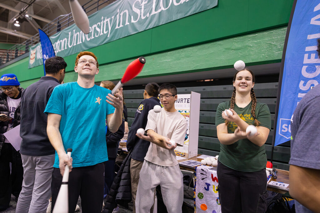 Members of the WashU Juggling Club juggle at an activities far