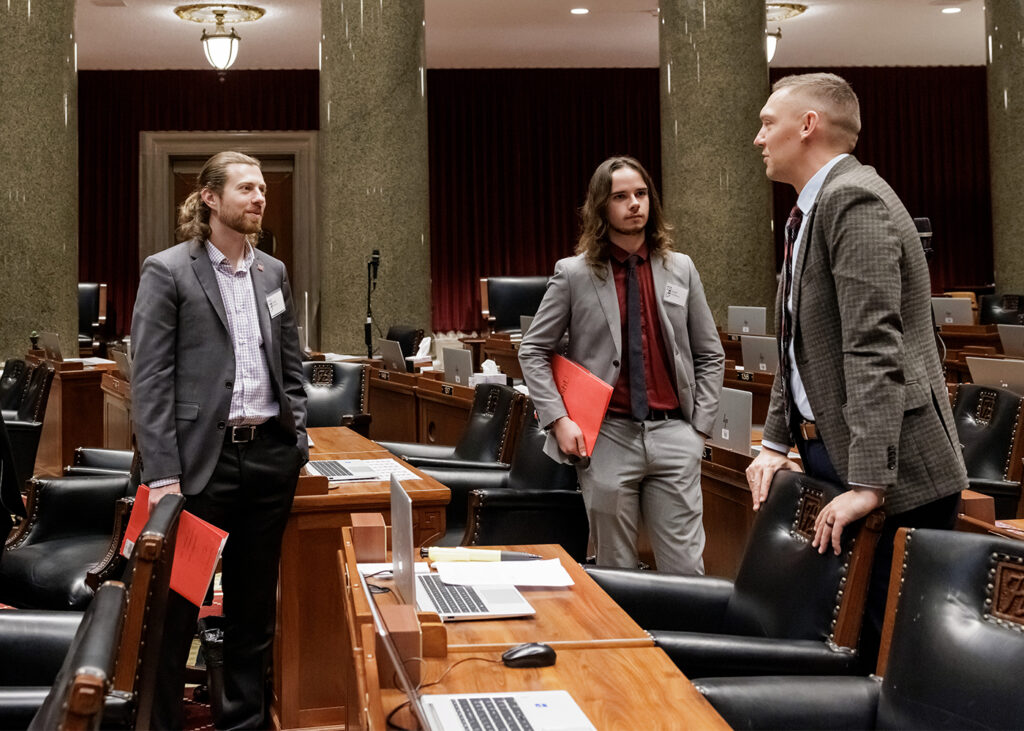 Rep. Philip Oehlerking (right) gives a tour of the Missouri House chambers to WashU students Josef Westberg (center) and Isaac Plutzer. (Photo: Whitney Curtis/WashU)