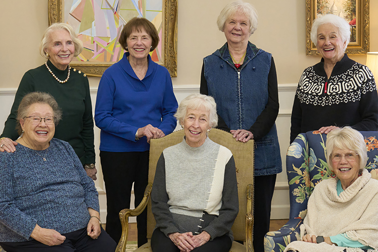 The sisters of Kappa Alpha Theta gather at the home of Bonnie Barton Wolfarth (standing at left) in January 2025. (Photo: Dan Donovan)