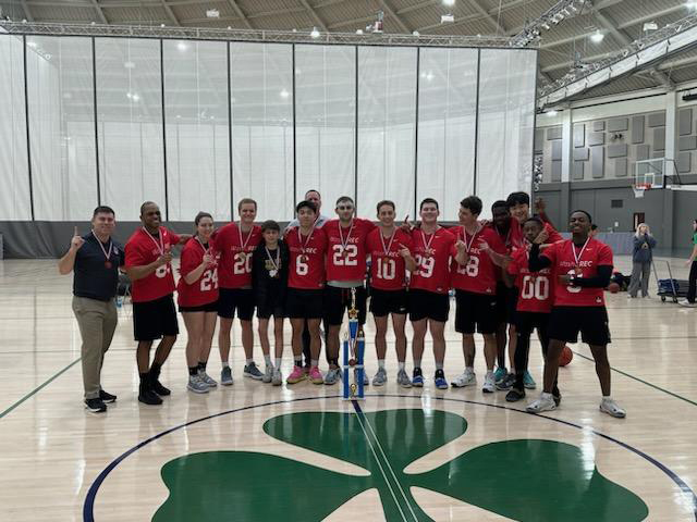 Basketball team photo with trophy