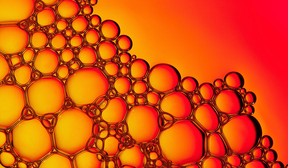 soap bubbles on an orange background