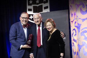 At the 2024 Founders Day celebration, Chancellor Andrew D. Martin presents the Robert S. Brookings Award to Roy and Diana Vagelos. Pioneers of scientific discovery, innovation and service-oriented leadership, the Vageloses have been instrumental in strengthening life science research and interdisciplinary education at WashU. (Photo: Joe Angeles/WashU)