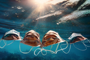 face masks floating in water
