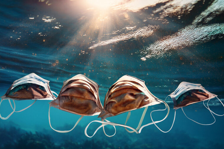 face masks floating in water