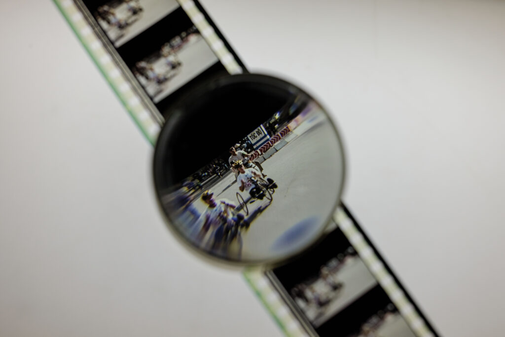 <i>Vietnam, Long Time Coming</i>, a 1998 Kartemquin Films documentary, follows a group of American and Vietnamese veterans on a 16-day, 1,200-mile bicycle journey along the coast of Vietnam. A film-editing loupe is used to examine a film reel. (Photo: Whitney Curtis/WashU)