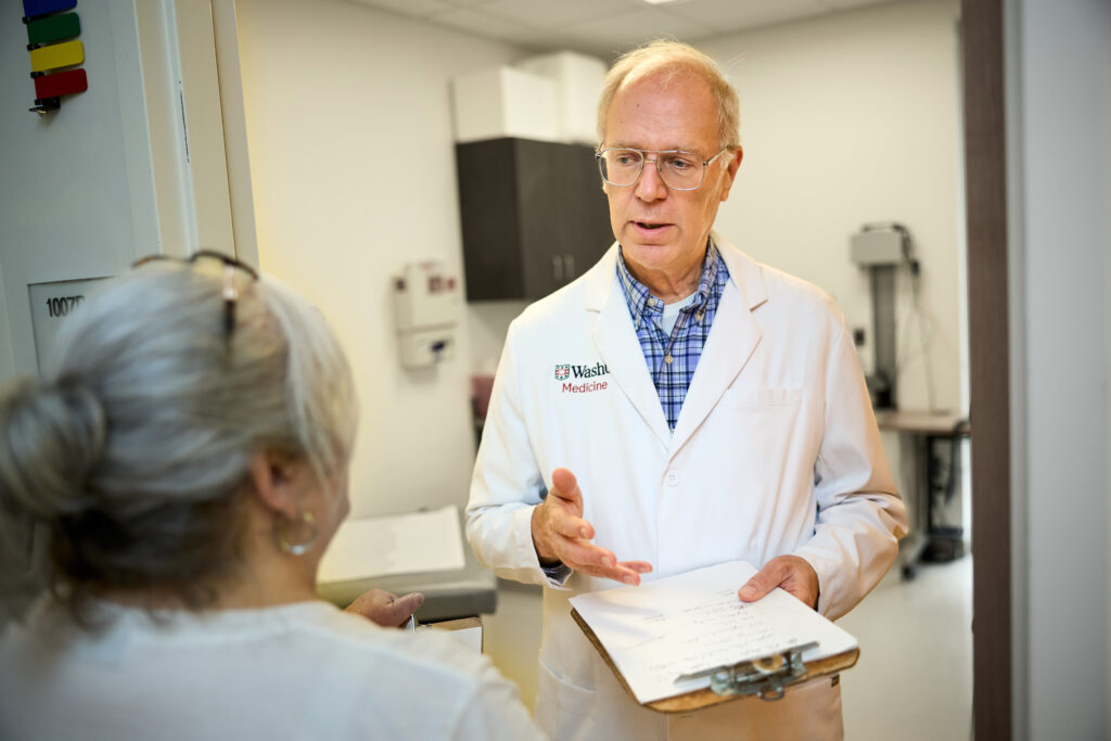 Thomas Bailey, MD (right), professor of medicine and medical director of the St. Louis County Department of Public Health (DPH) TB Program, confers with Tracey Swaringen, the program's nurse supervisor, at the DPH TB Chest Clinic. (Photos: Matt Miller/WashU Medicine)