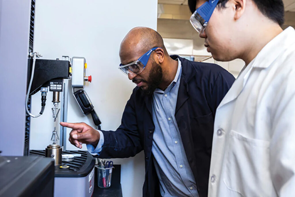 researcher with protective glasses in a lab space